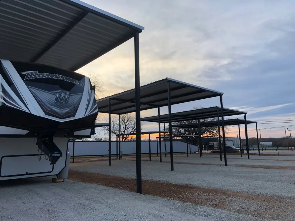 A covered site with an RV parked under the carport
