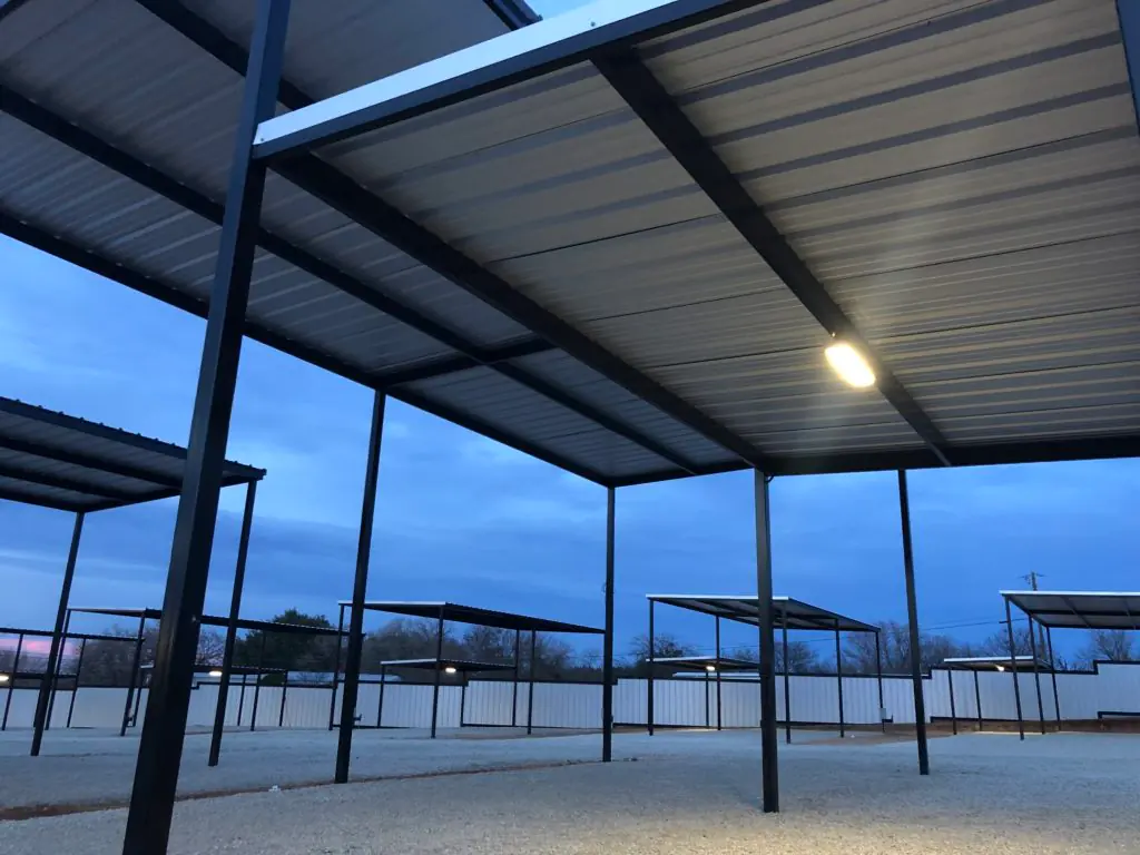 Looking up at a carport roof and light